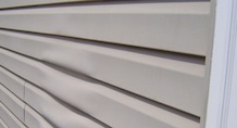 warped vinyl siding
